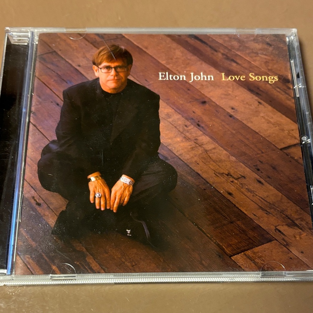 Universal Elton John Love Songs CD - Black and Brown